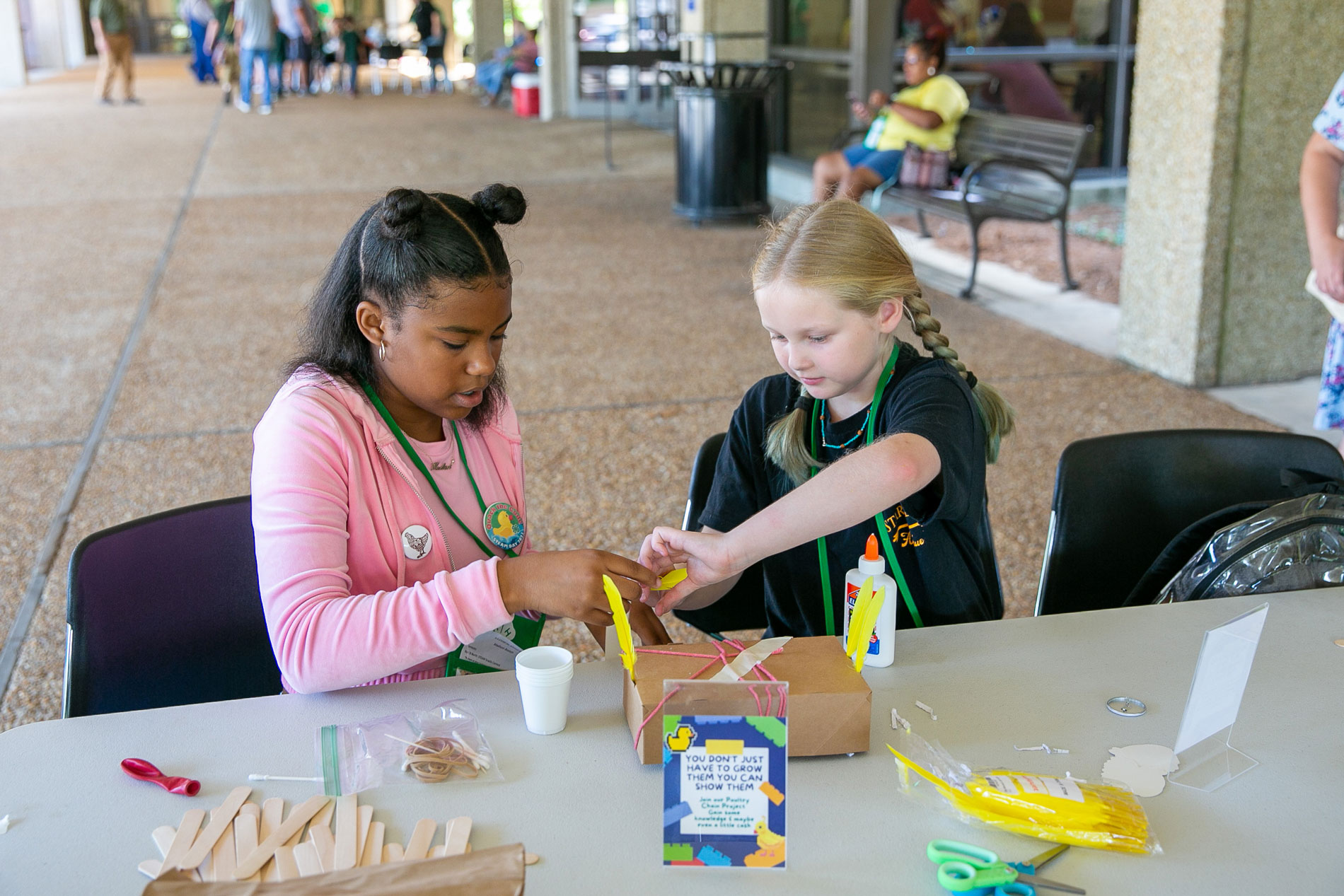 Two girls working together with modeling clay