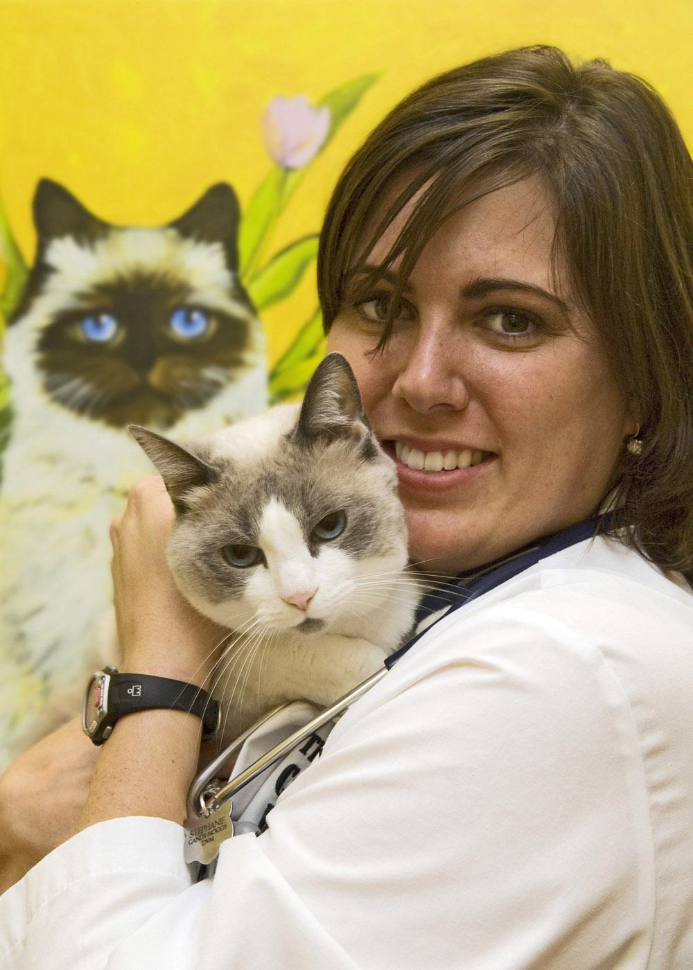 Stephanie Gandy-Moody and her cat, Isabelle, demonstrate that trust works wonders when handling feline patients. (Photo by Tom Thompson)