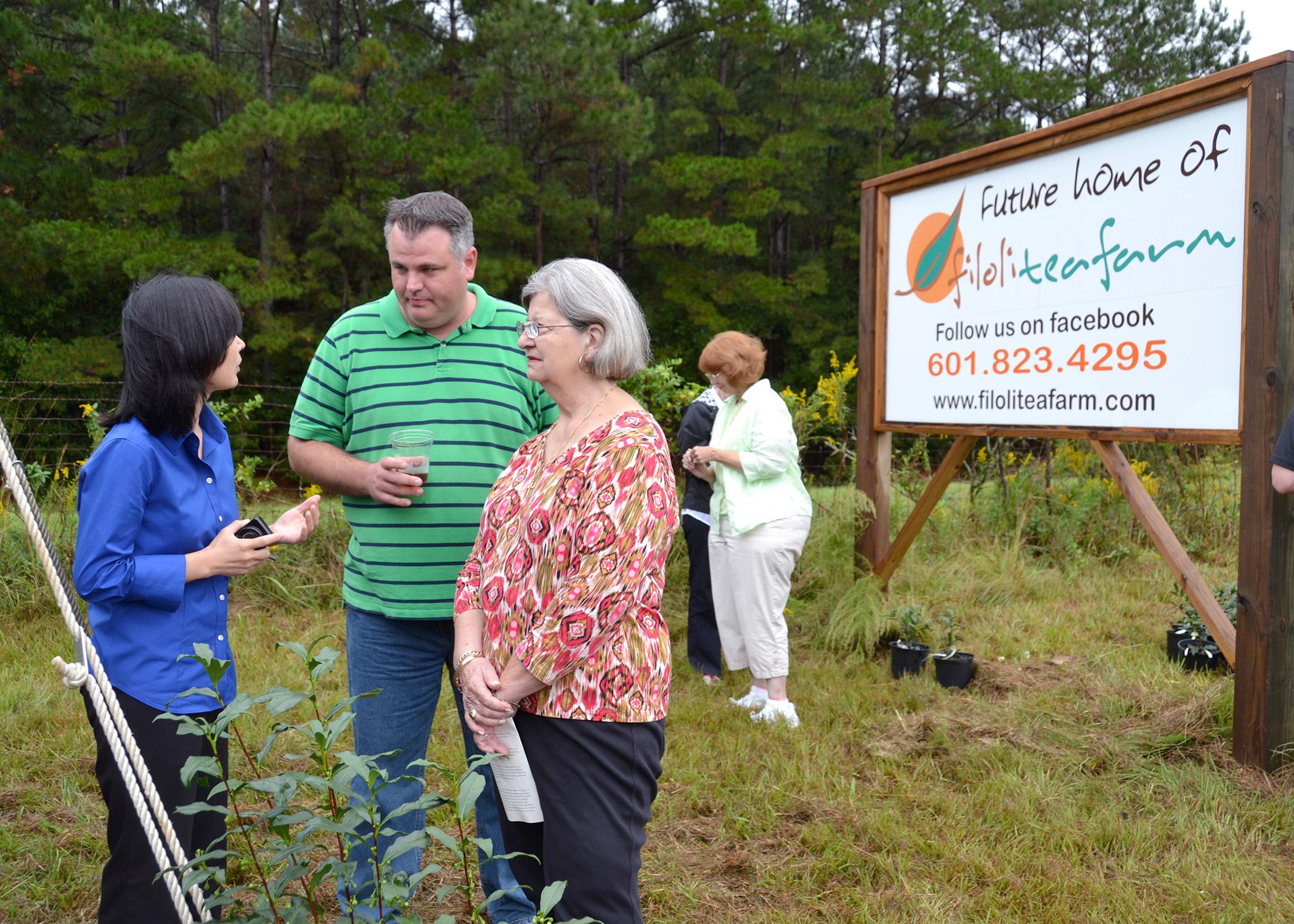 Jason McDonald (center), FiLoLi Tea Farm owner, talks with Guihong Bi (left), associate research and Extension Professor with Mississippi State University and Shirley Estes, Lincoln County Master Gardener, after the Oct. 17 groundbreaking for the first-ever commercial tea-growing operation in Mississippi. (Photo by MSU Ag Communications/Susan Collins-Smith)