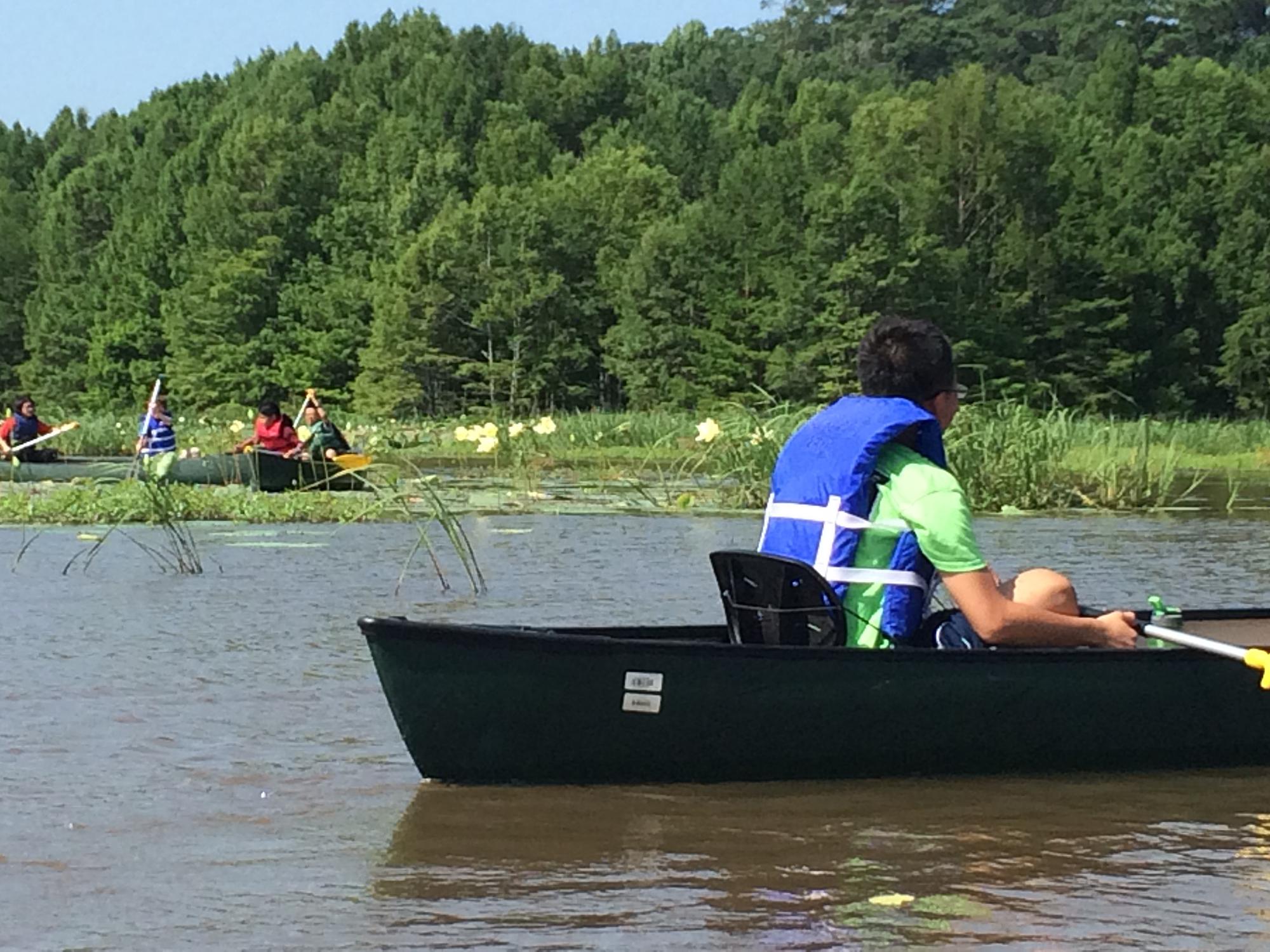 Young people enjoy canoe excursions on Bluff Lake in the Sam D. Hamilton Noxubee National Wildlife Refuge, located south of Starkville, Mississippi. (Photo by MSU Extension Service/Evan O’Donnell) 