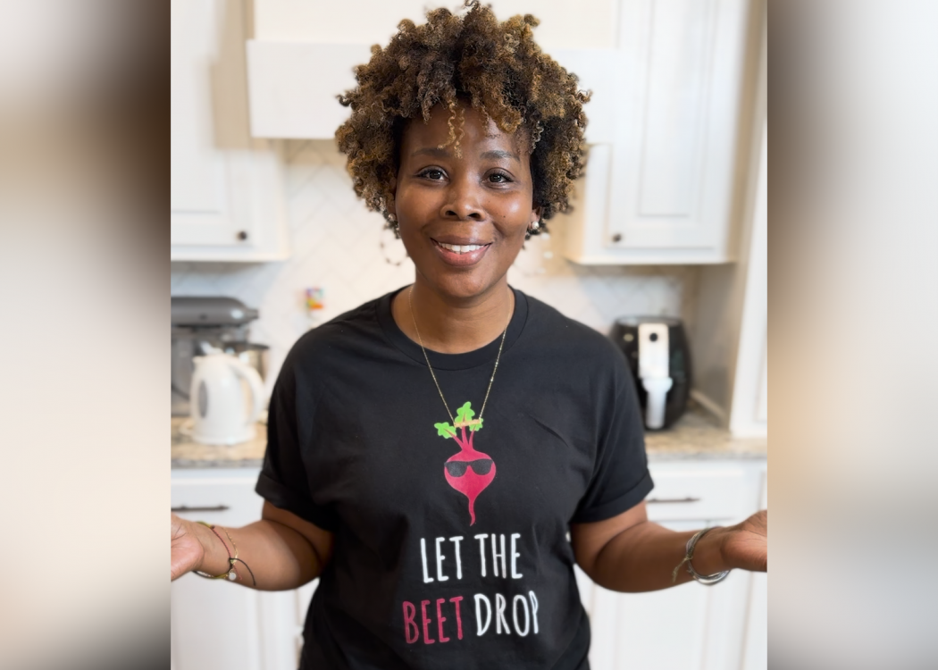 A woman stands in a kitchen