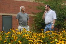 MSU landscape architectural professor Robert Brzuszek, left, and ornamental horticulture professor Richard Harkess examine Black-eyed Susans, which can be a good choice for landscapers who desire to use native plants. (Photo by Kat Lawrence)