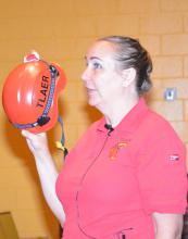 Dr. Rebecca Gimenez, an instructor for the Technical Large Animal Emergency Response course at Mississippi State University on March 29, 2014, explains that head protection is essential when people are helping large, distressed animals. (Photo by MSU Ag Communications/Linda Breazeale)