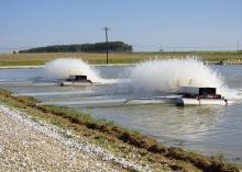 Intensively managed and split-cell catfish ponds are stocked at much higher rates and require more aeration to supply sufficient oxygen. These aerators were running on a Noxubee County, Mississippi, catfish farm on March 21, 2017. (Photo by MSU Extension Service/Kat Lawrence)