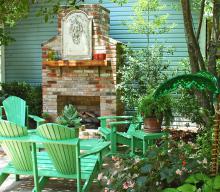 This outdoor room uses an Adirondack-style love seat with a matching coffee table, end table and set of chairs. The furniture helps create a space that is soothing and inviting. (Photos by Norman Winter)