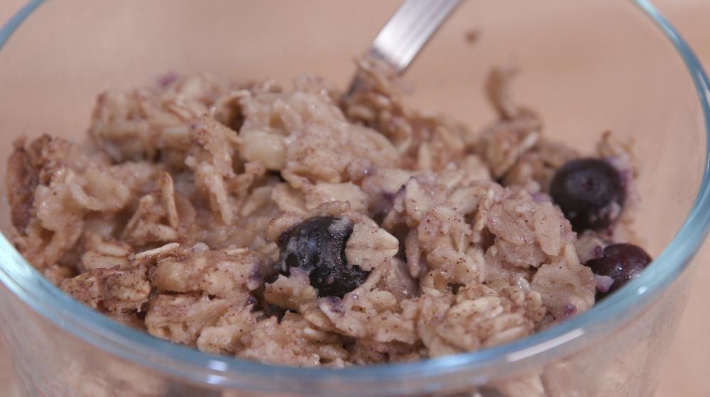 A bowl of blueberry baked oatmeal.