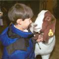 Ten-year-old Nolan Webb of Lafayette County 4-H has one last visit with Showboy, the grand champion market goat at the 2002 Dixie National Junior Livestock Show in Jackson, Miss., on Feb. 7, 2002.