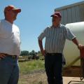 Farming award winner John Ingram, left, visits on his farm with Yalobusha County Extension Director Steve Cummings one early summer day. Both men are among several Yalobusha County residents to earn recognition for their work in agriculture.