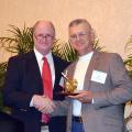 Scott Rowland, South Central regional vice president of the Forest Landowners Association, presents their Extension Forester of the Year award to Don Bales of Purvis, a forest and wildlife management specialist with Mississippi State University's Extension Service. (Submitted Photo)