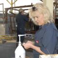 Dr. Linda Farris of the Animal Health Center in Brookhaven examines an artificial insemination rod before use. Farris took part in Mississippi State University's reproduction workshop for cattle producers on March 15, 2013. (Photo by MSU Ag Communications/Linda Breazeale)