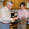 Lynn McMahan of Vancleave, president of the Mississippi Master Gardeners, learns about plant diseases from Clarissa Balbalian, manager of the Mississippi State University Extension Service's plant diagnostic lab, during campus tours on Oct. 1, 2013. (Photo by MSU Ag Communications/Linda Breazeale)