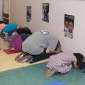 Preschoolers and workers practice together during a tornado drill at the Mississippi State University Child Development and Family Studies Center on July 16, 2014. (Photo by MSU Ag Communications/Kat Lawrence)