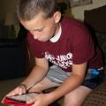 David Coblentz, 12, uses a search engine on an iPad mini. Parents should take some practical steps to help ensure their children are protected as they use Internet-connected devices to socialize or do homework. (Photo by MSU Communications/Bonnie Coblentz)