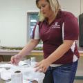 Kandiace Gray, a Mississippi State University graduate student from Fulton, prepares materials for workshop on growing mushrooms, mosses and ferns on July 8, 2014 at Dorman Hall on the Starkville campus. (Photo by MSU Ag Communications/Kevin Hudson)