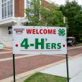 A sign that reads “Welcome 4-H’ers” and has the Mississippi State Extension logo.