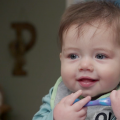 A 10-month-old baby eats homemade baby food.