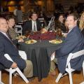 Six guests pause for a photo during a formal dinner.