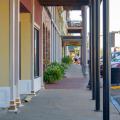 A view down a covered downtown sidewalk.