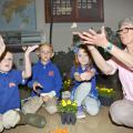 From left, kindergarteners Garrison Baker, Knox Smith and Piper Graves learn about painted lady butterflies with Lois Connington, keeper of the Insect Zoo at Mississippi State University’s Clay Lyle Entomology Building on Thursday, April 14, 2016 in Starkville, Miss. (Photo by MSU Extension Service/Kat Lawrence)