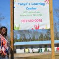 LaTonya Hill stands outside Tonya’s Learning Center, her new licensed child care center in Waynesboro, Mississippi on Feb. 18, 2016.