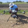 David Young, a flight coordinator with the Geosystems Research Institute at Mississippi State University, prepares an unmanned aircraft to fly over test plots at the H. H. Leveck Animal Research Center April 7, 2016. (Photo by MSU Extension/Kevin Hudson)