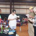 Oktibbeha County 4-H member Trukyra Lawrence, left, waits as judges, from left, Theresa Sproles, Edwin Taylor and Lanelle Martin evaluate her grilling area at the 2016 North Half State Cook-Off competition on June 28, 2016. (File photo by MSU Extension Service/ Kat Lawrence) 