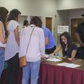 Mississippi 4-H members gathered at Mississippi State University Tuesday, July 15, 2014, for the four-day workshop and tour to learn about business cooperatives and state government. Marella Failla of Hancock County, the state 4-H Council president, helped with registration. (Photo by MSU Ag Communications/Kevin Hudson)